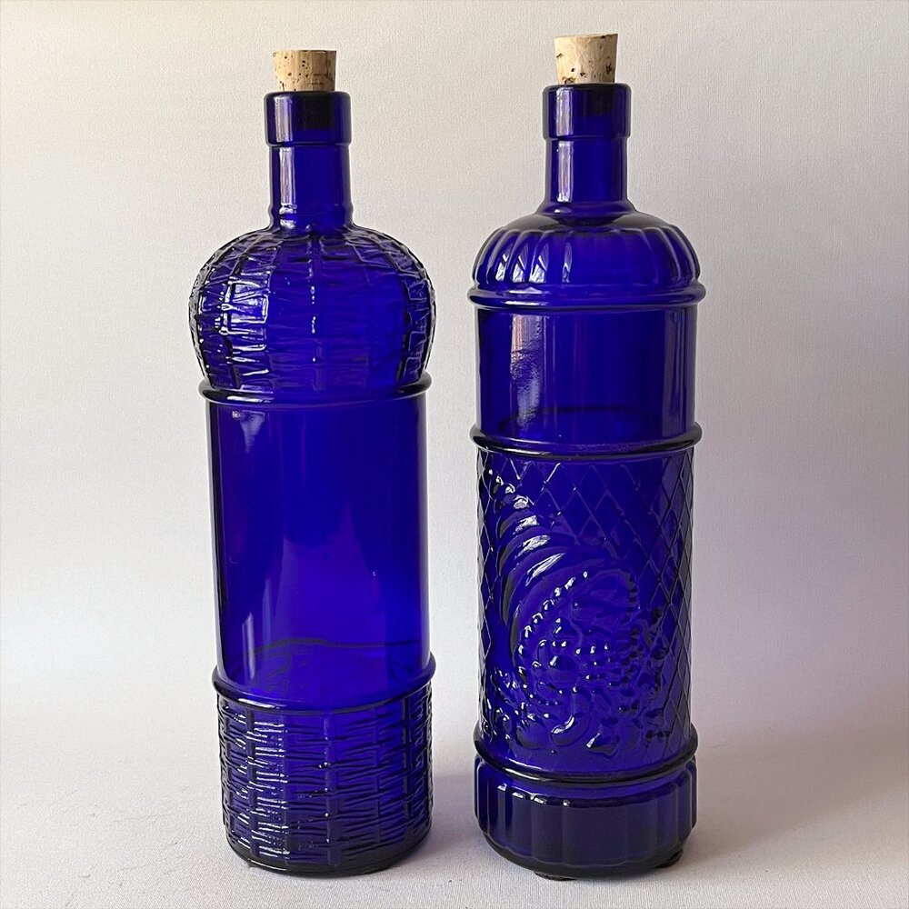 2 Vintage Cobalt Blue Embossed Glass Bottles with Cork Canada 11” Tall